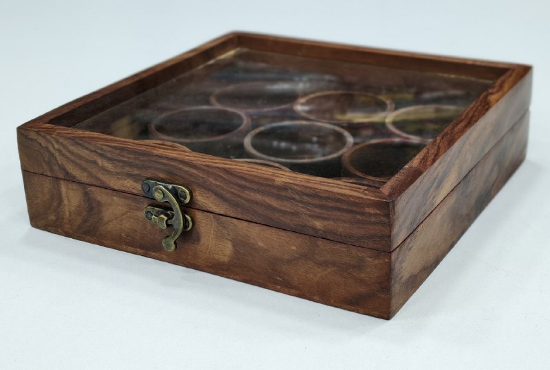 Square wooden spice box made from sheesham wood with a transparent glass lid and detachable round containers