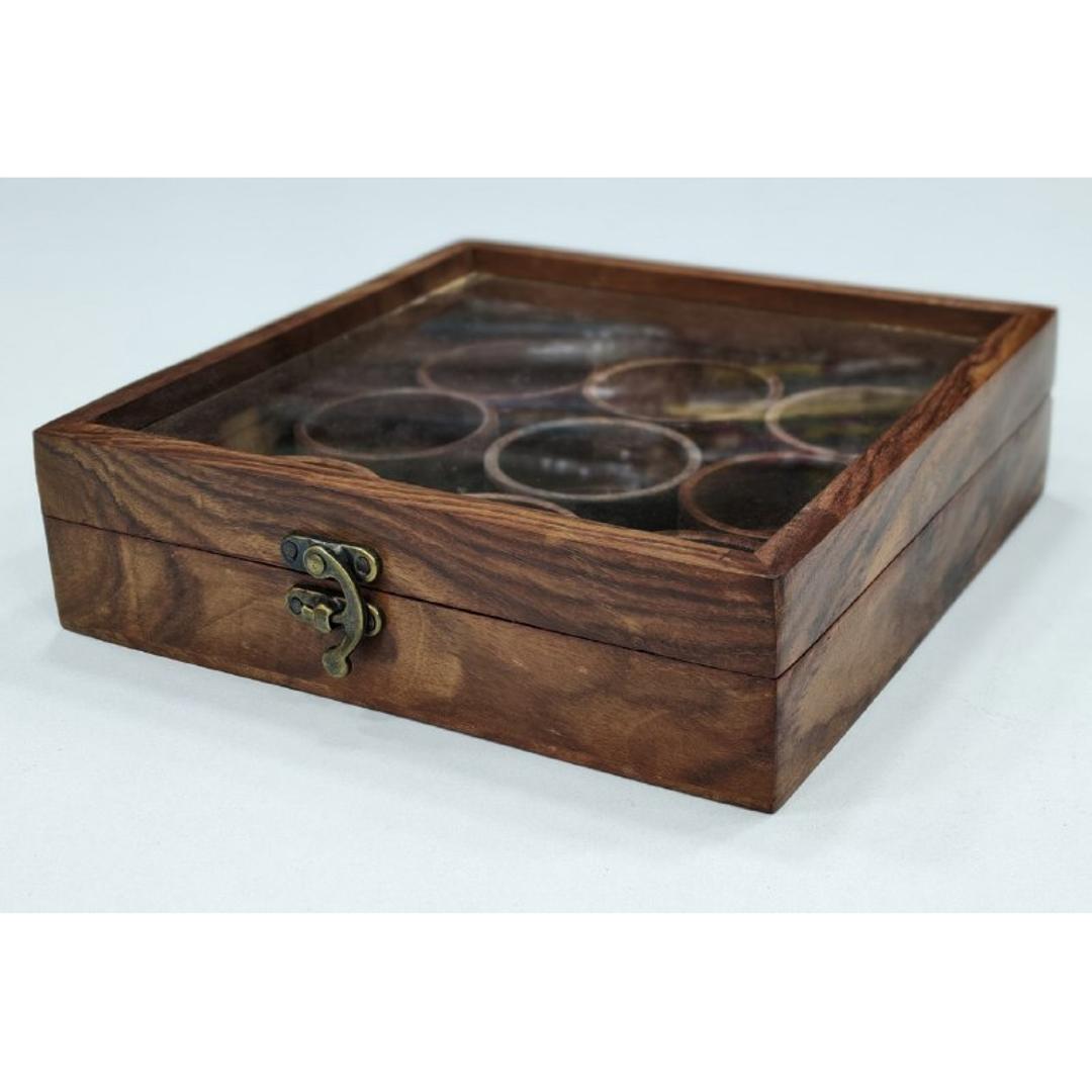 Square wooden spice box made from sheesham wood with a transparent glass lid and detachable round containers